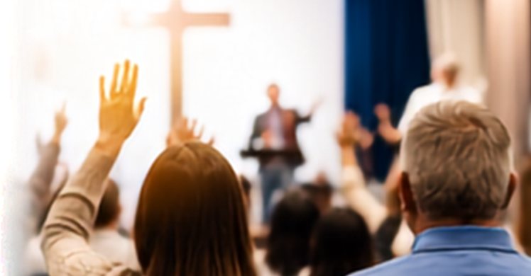 Congregation worshiping with raised hands during a church service